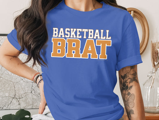 Blue t-shirt with "BASKETBALL BRAT" in white and orange text.