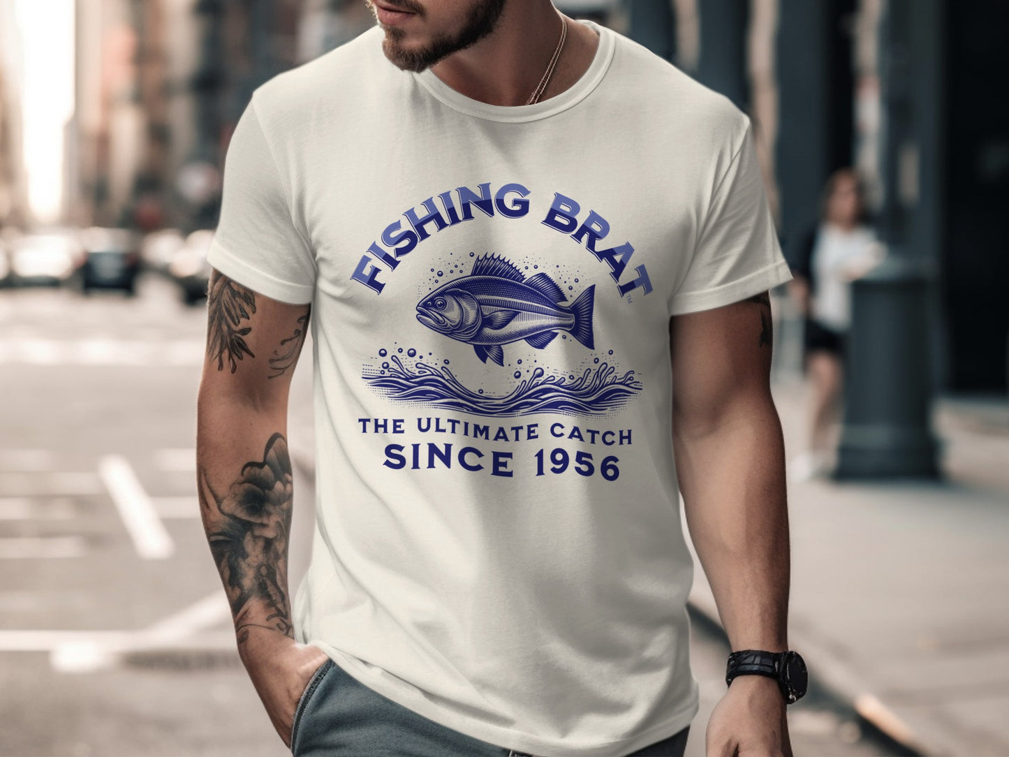White t-shirt with "Fishing Brat The Ultimate Catch Since 1956" and fish graphic.