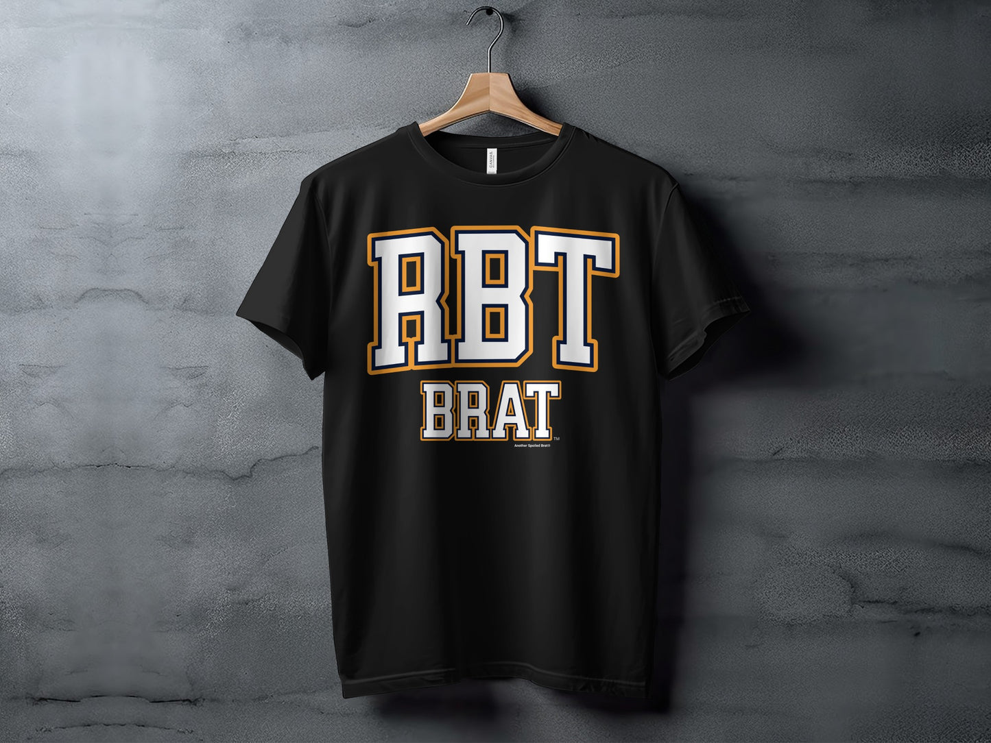 Black t-shirt with white and gold "RBT BRAT" lettering.