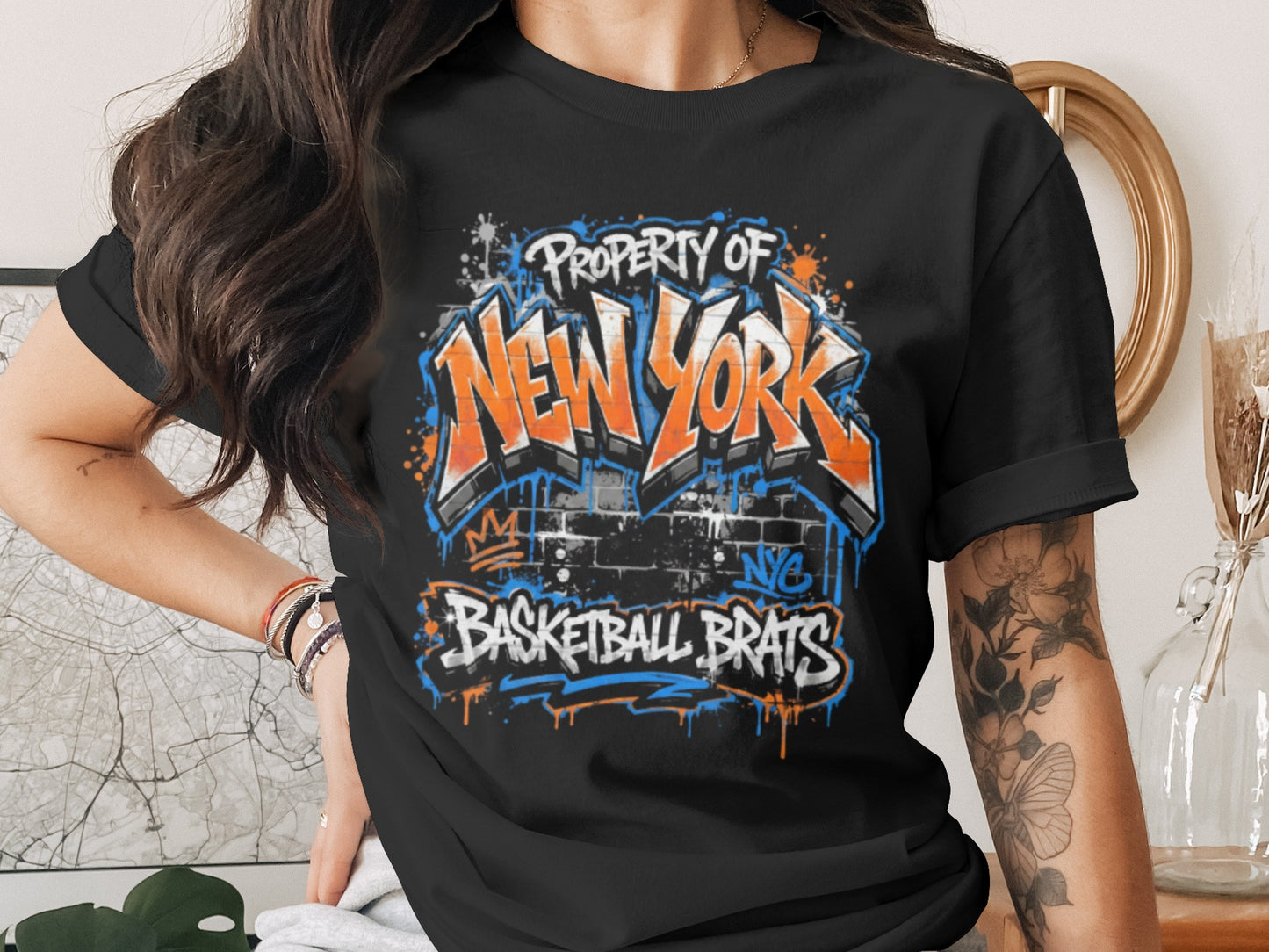 Black t-shirt with "Property of New York Basketball Brats" graffiti-style text.