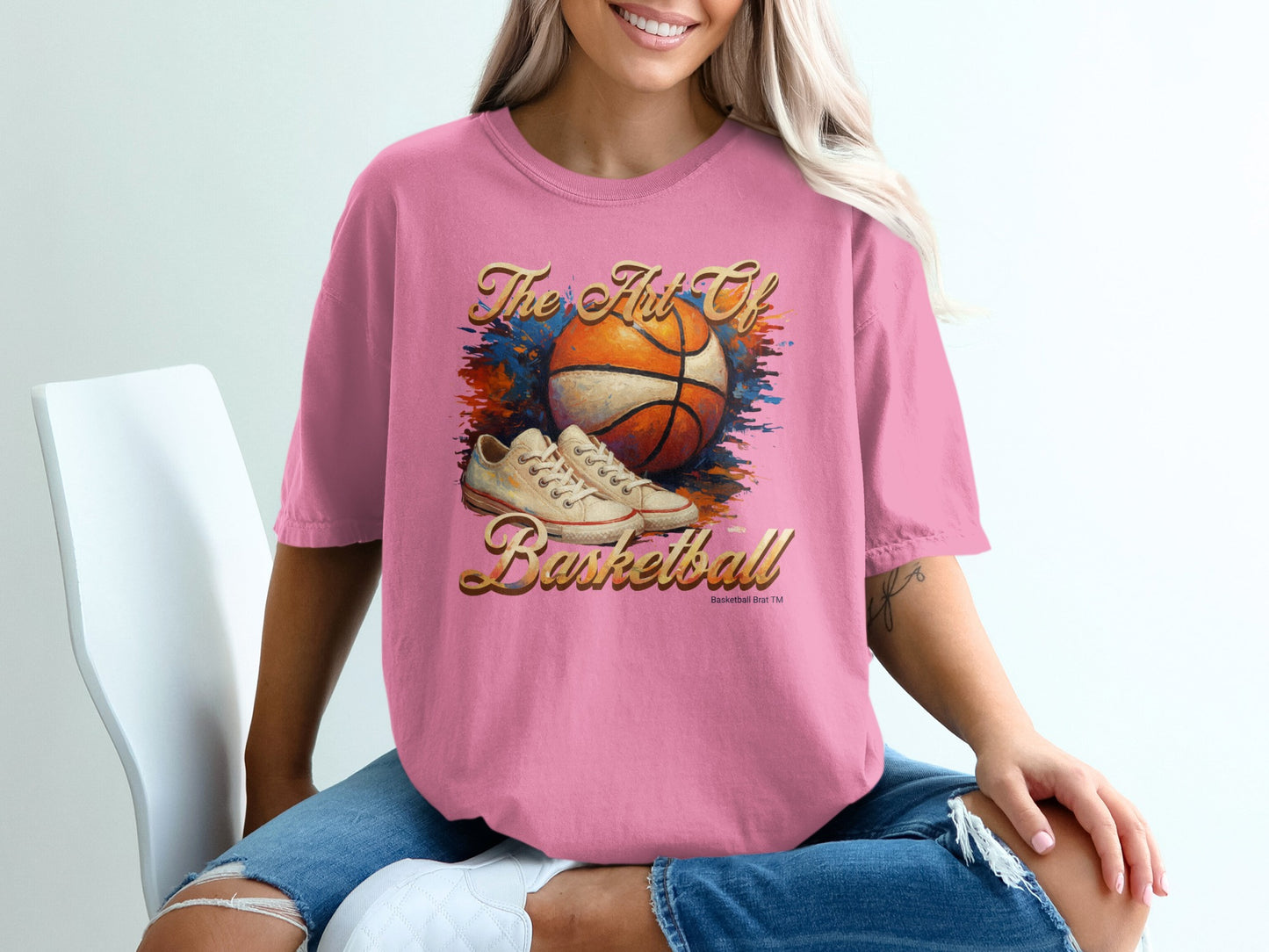Pink t-shirt with "The Art of Basketball" and basketball graphic.