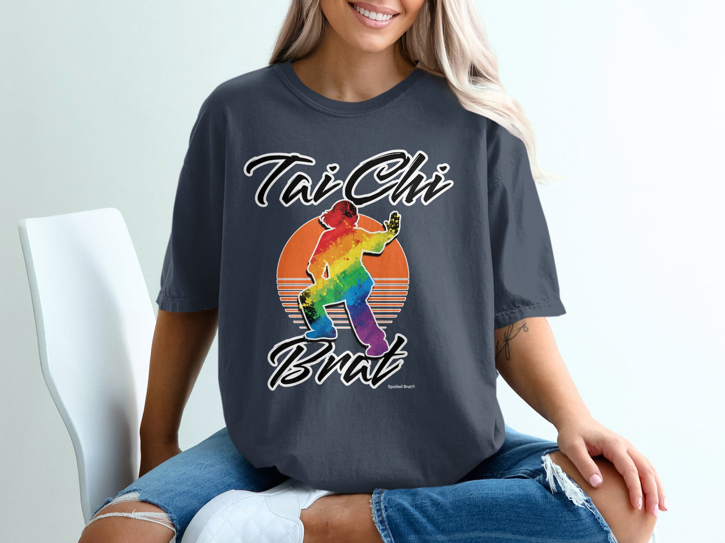 "Tai Chi Brat" text over a rainbow-colored silhouette of a person in a Tai Chi pose.
