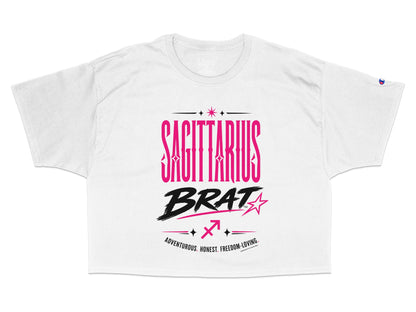 White crop top with "SAGITTARIUS BRAT" text and zodiac symbol.