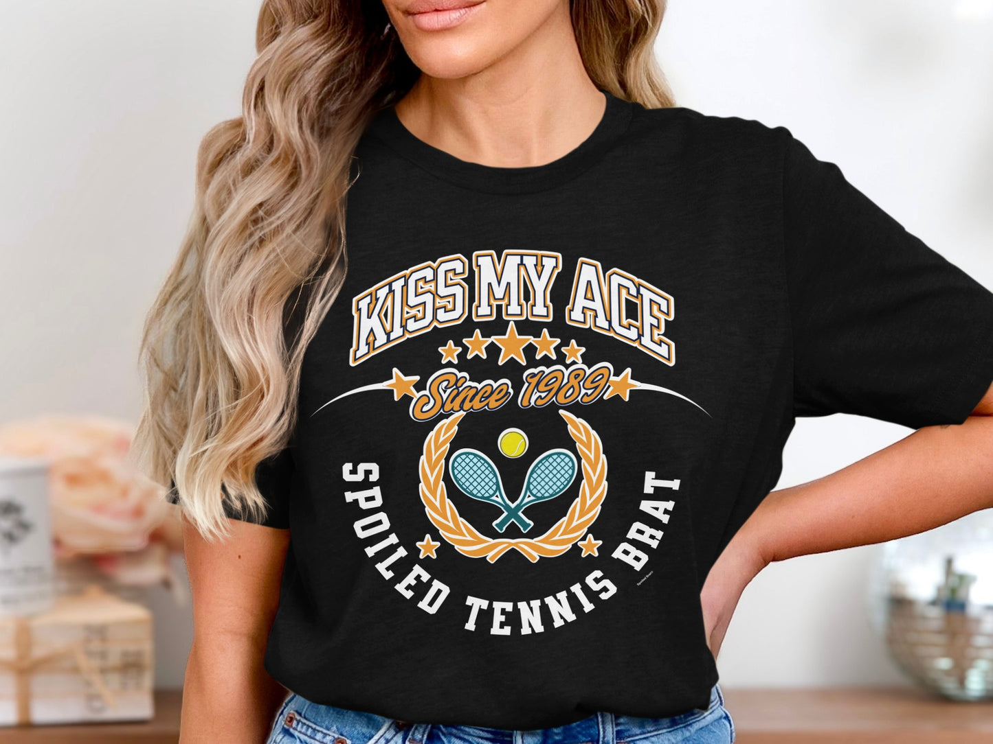 Black t-shirt with "Kiss My Ace Spoiled Tennis Brat" text and tennis graphics.