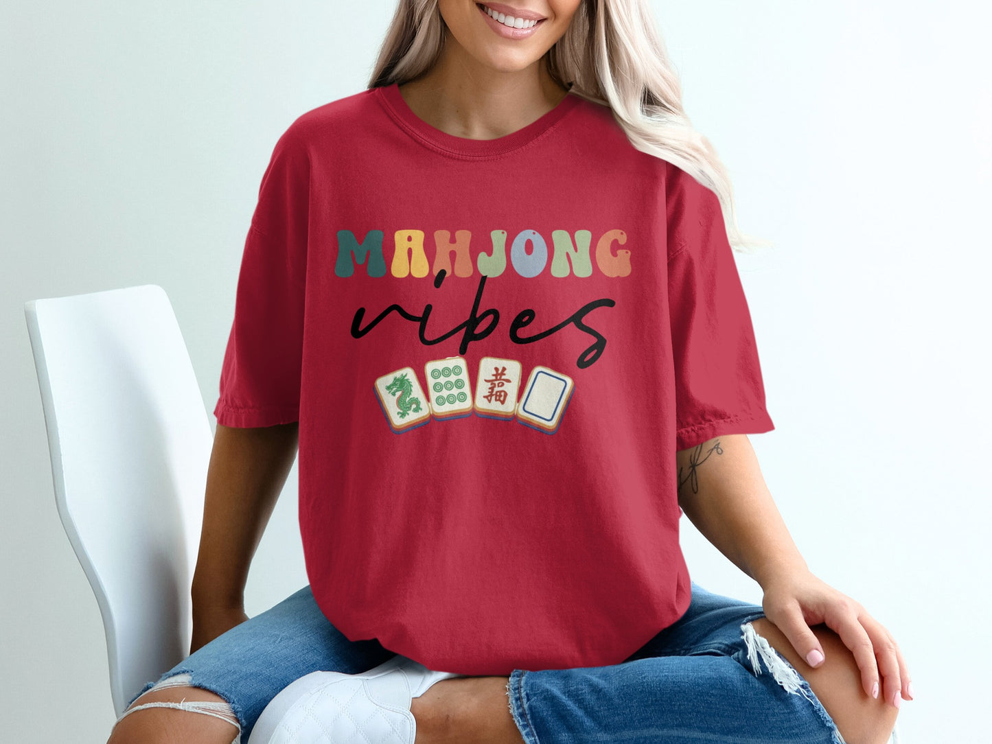 Mahjong vibes text with mahjong tiles on a red t-shirt.