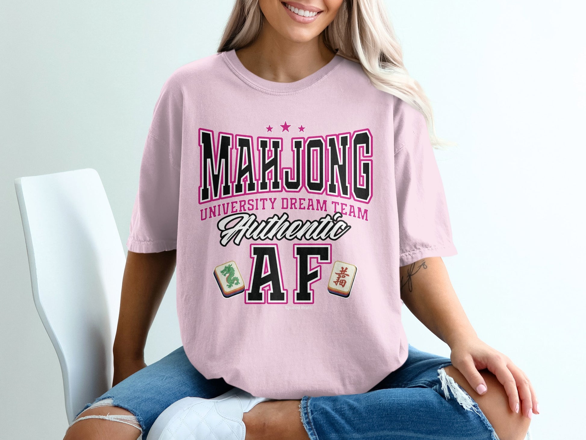 Pink t-shirt with "Mahjong University Dream Team Authentic AF" text and mahjong tiles.