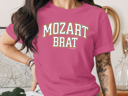 Pink t-shirt with "MOZART BRAT" text in collegiate font.