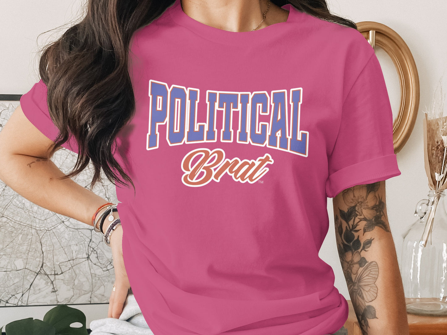 Fuchsia t-shirt with "POLITICAL Brat" text in blue and orange.