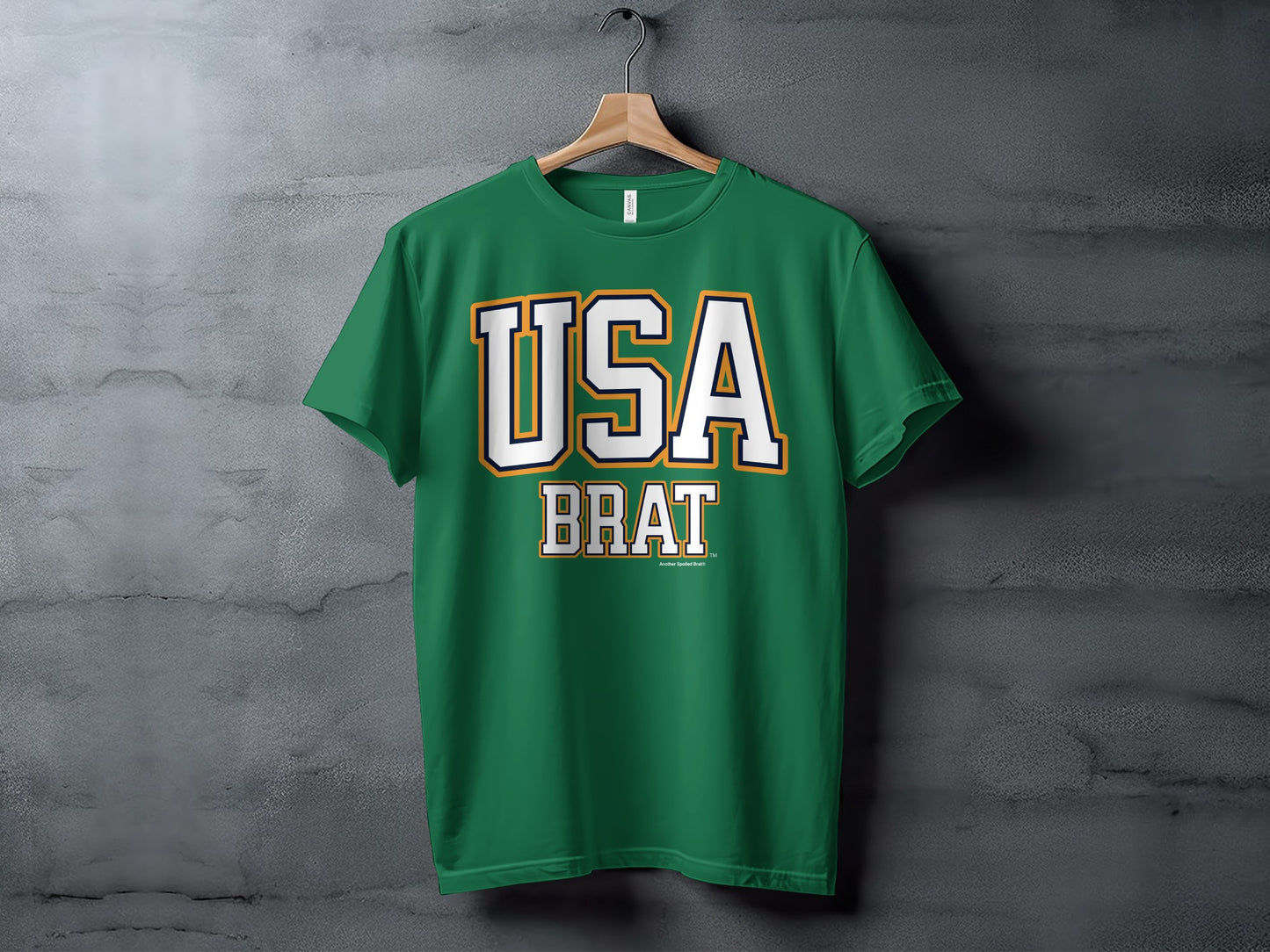 Green t-shirt with "USA BRAT" text on a concrete background.