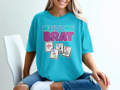 Mahjong Brat graphic on a teal t-shirt with Mahjong tiles.