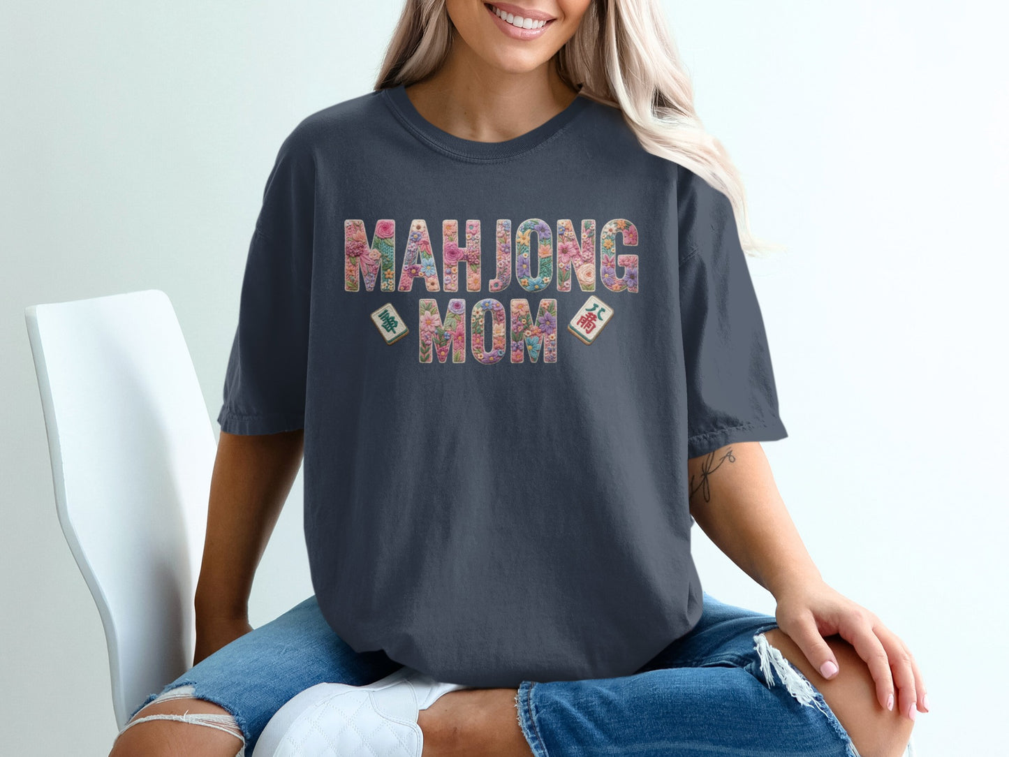 Mahjong Mom graphic tee with floral letters and tile accents.