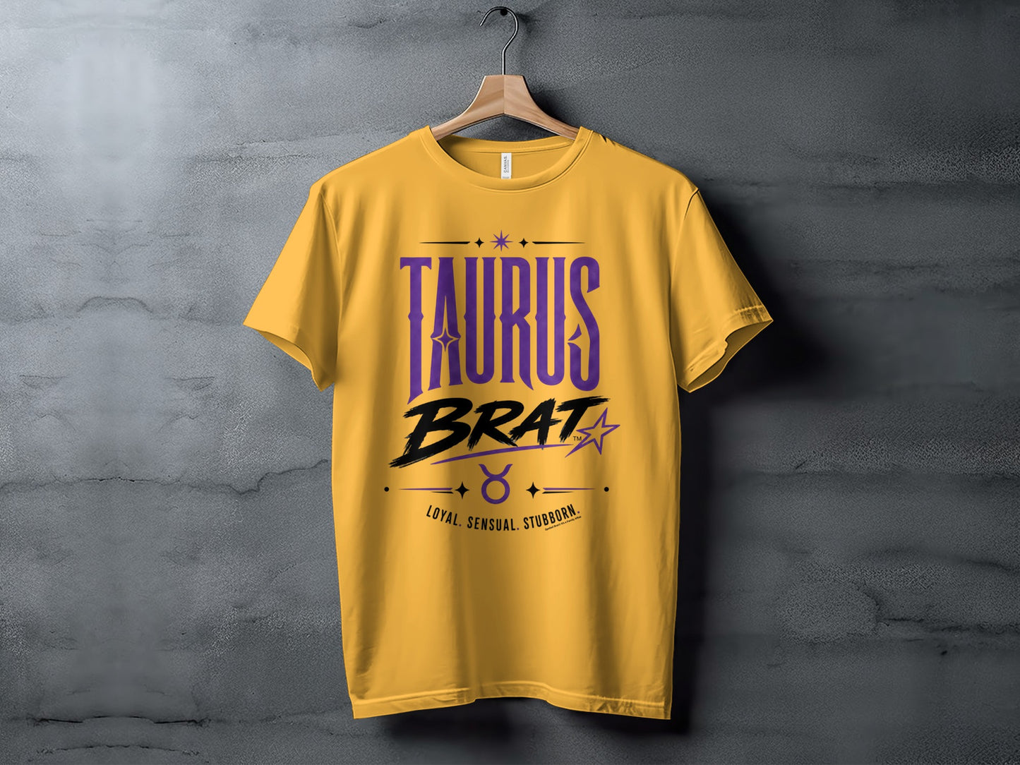 Yellow t-shirt with "TAURUS BRAT" and traits loyal, sensual, stubborn.