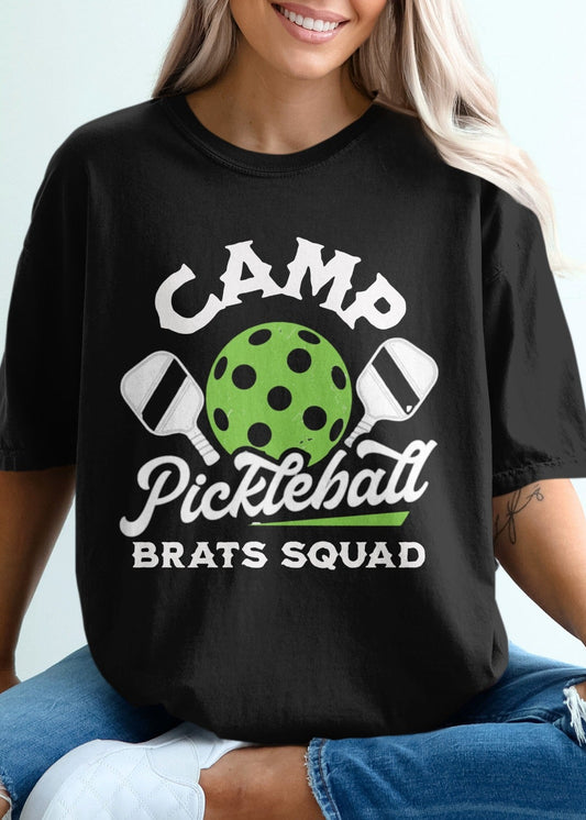 Black t-shirt with "Camp Pickleball Brats Squad" text and pickleball graphic.