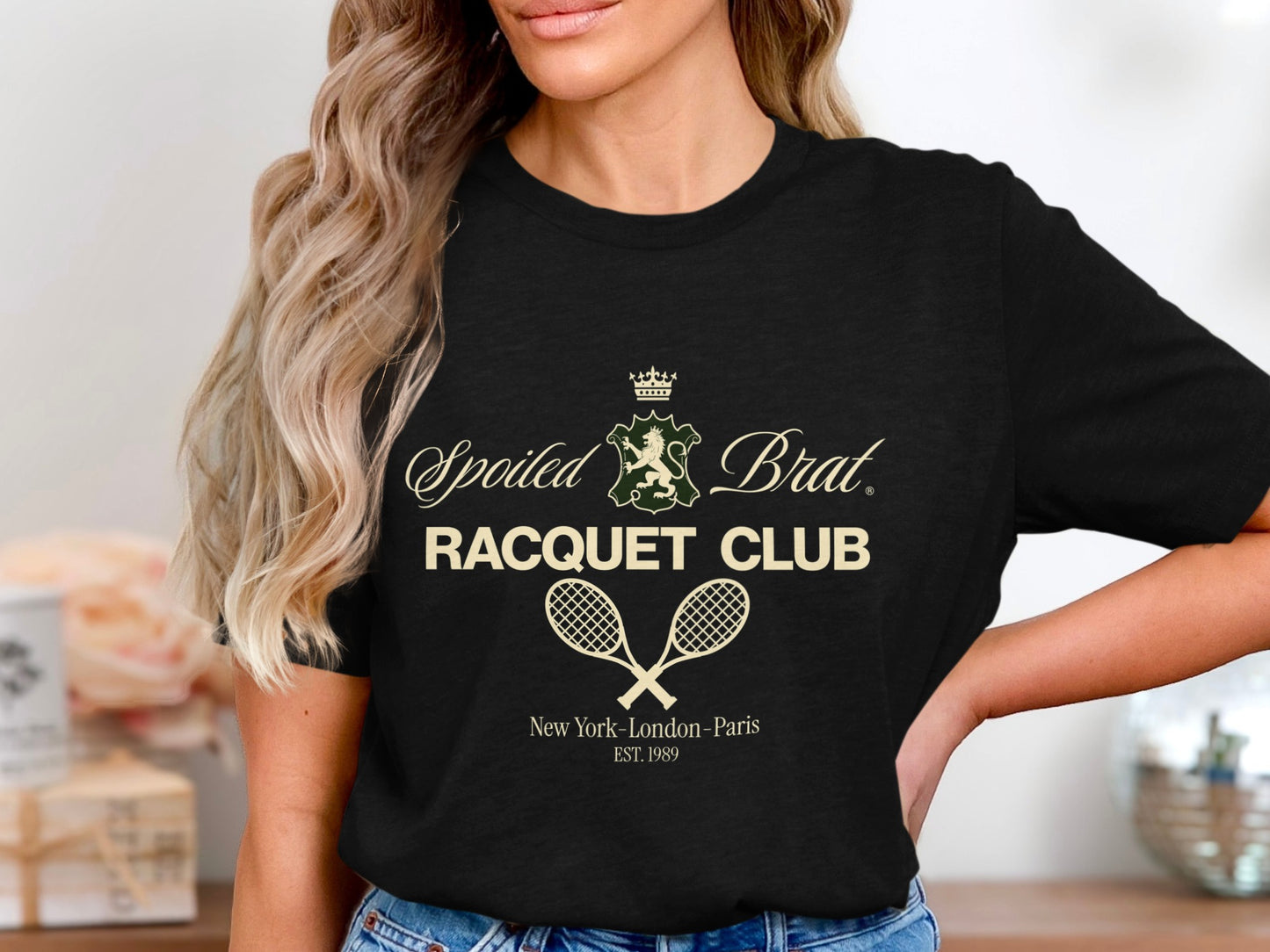 Black t-shirt with "Spoiled Brat Racquet Club" text and crossed tennis rackets.
