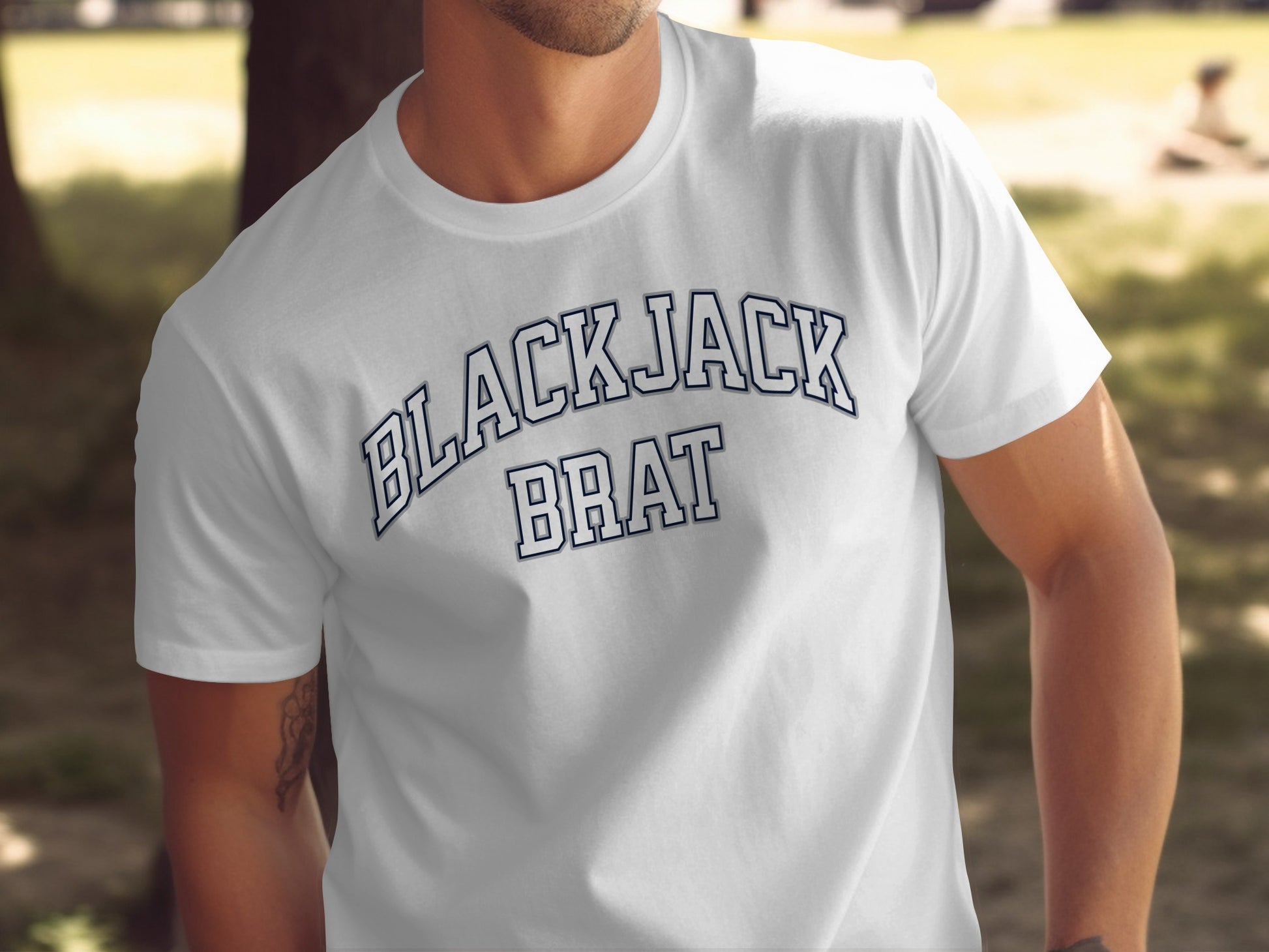 White t-shirt with navy blue arched text "BLACK JACK BRAT"