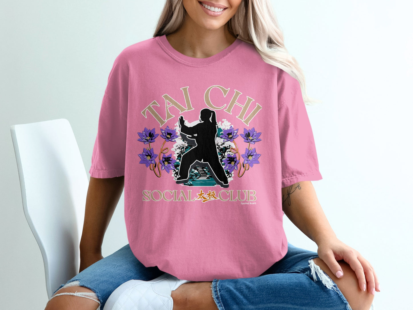 Pink t-shirt with Tai Chi Social Club graphic and lotus flowers.