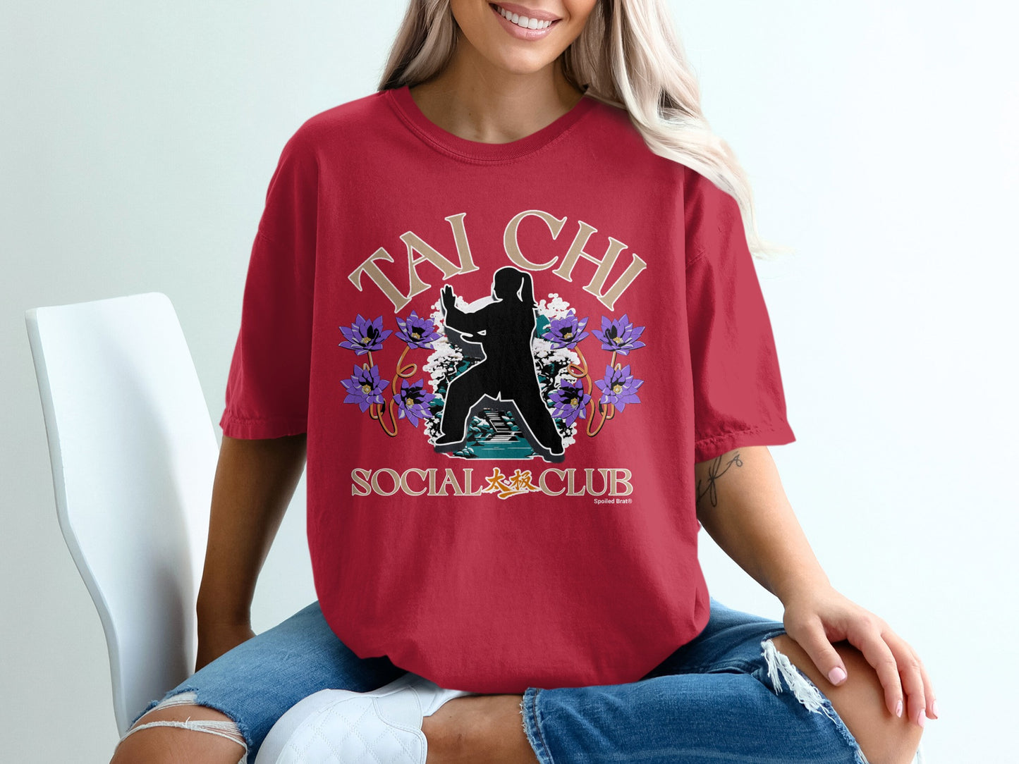 Red t-shirt with "Tai Chi Social Club" text and a silhouette practicing Tai Chi among flowers.