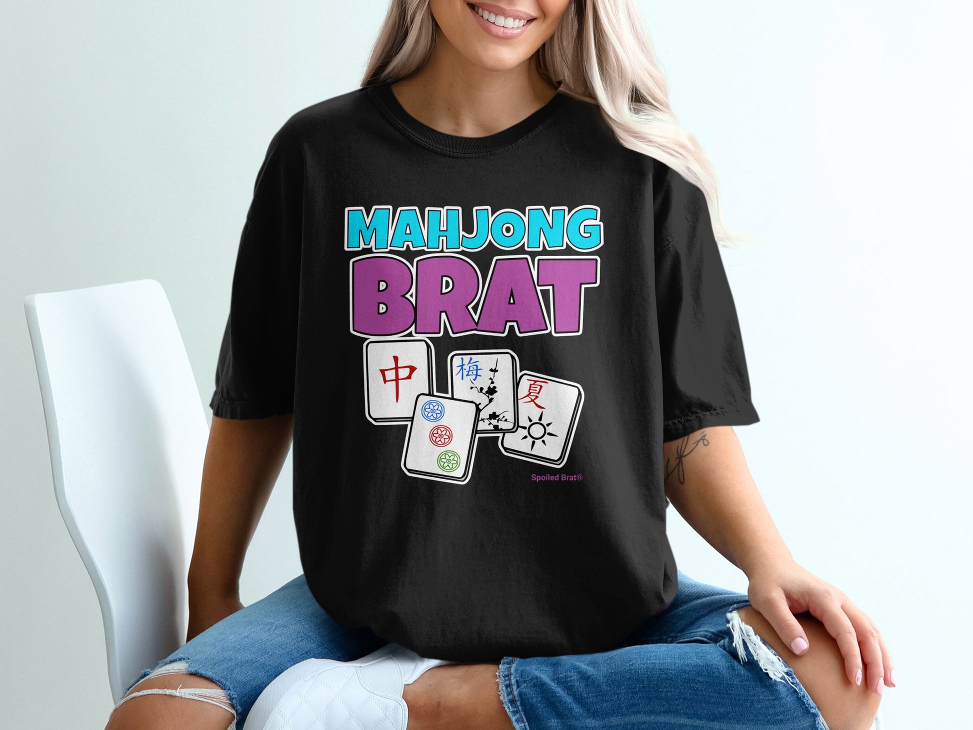 Black t-shirt with "MAHJONG BRAT" text and Mahjong tiles.
