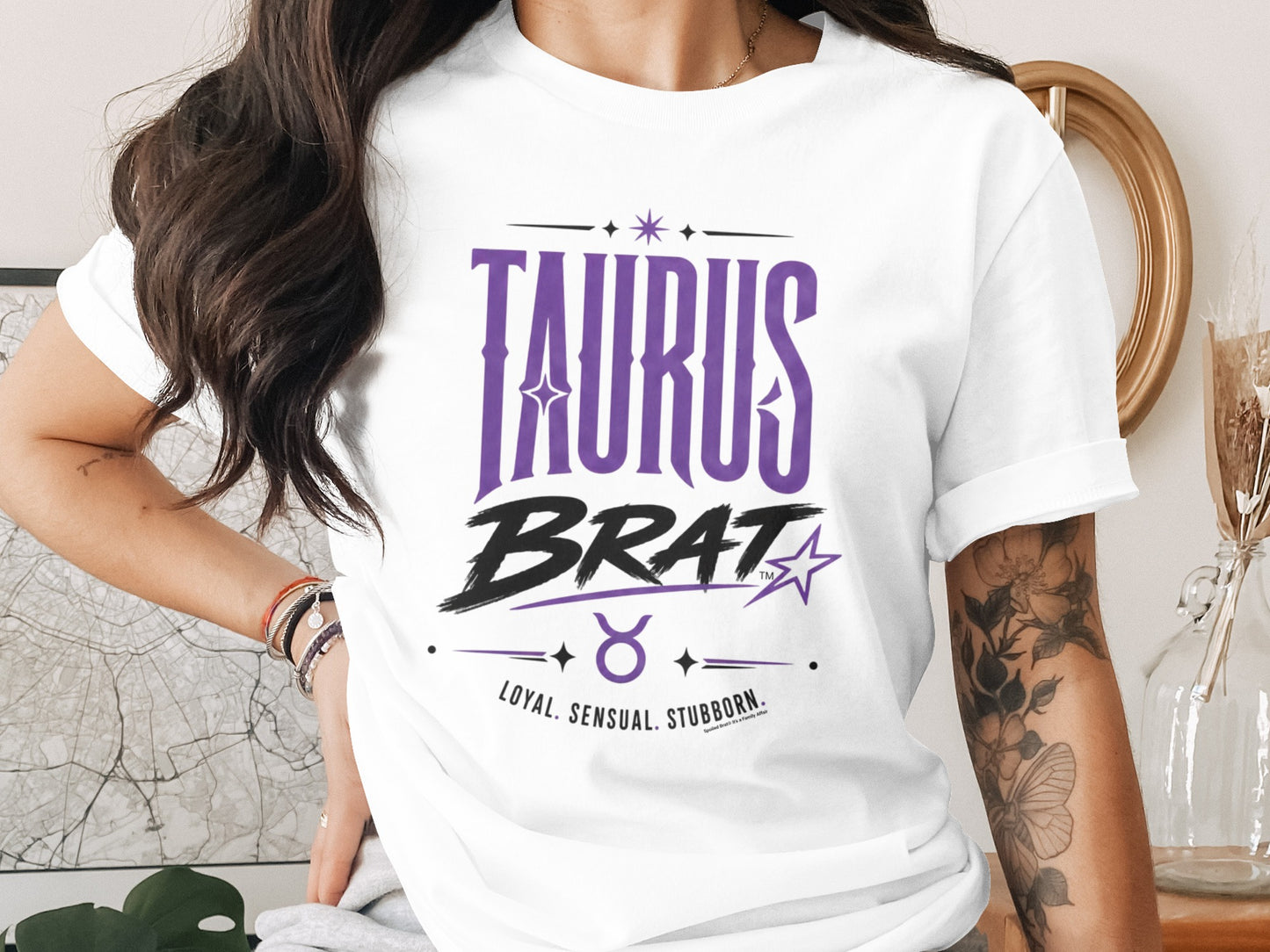 White t-shirt with "TAURUS BRAT" text, bull symbol, and "LOYAL. SENSUAL. STUBBORN."