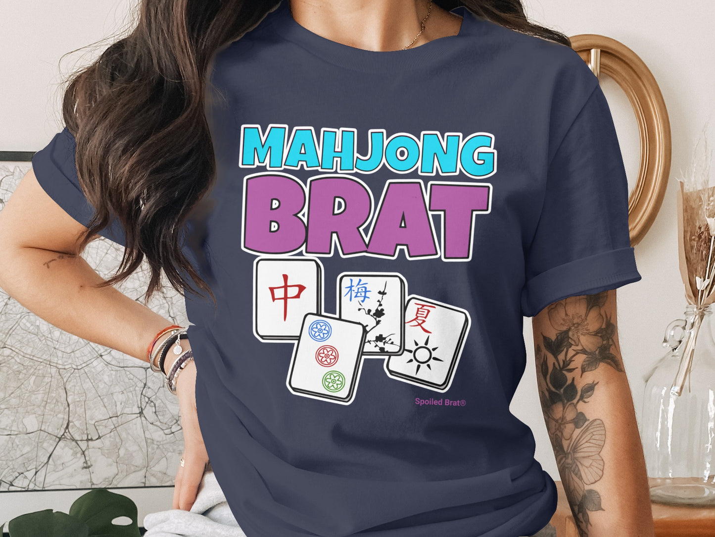 Dark blue t-shirt with "Mahjong Brat" text and mahjong tiles.