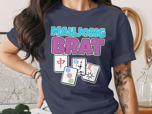 Dark blue t-shirt with "Mahjong Brat" text and mahjong tiles.