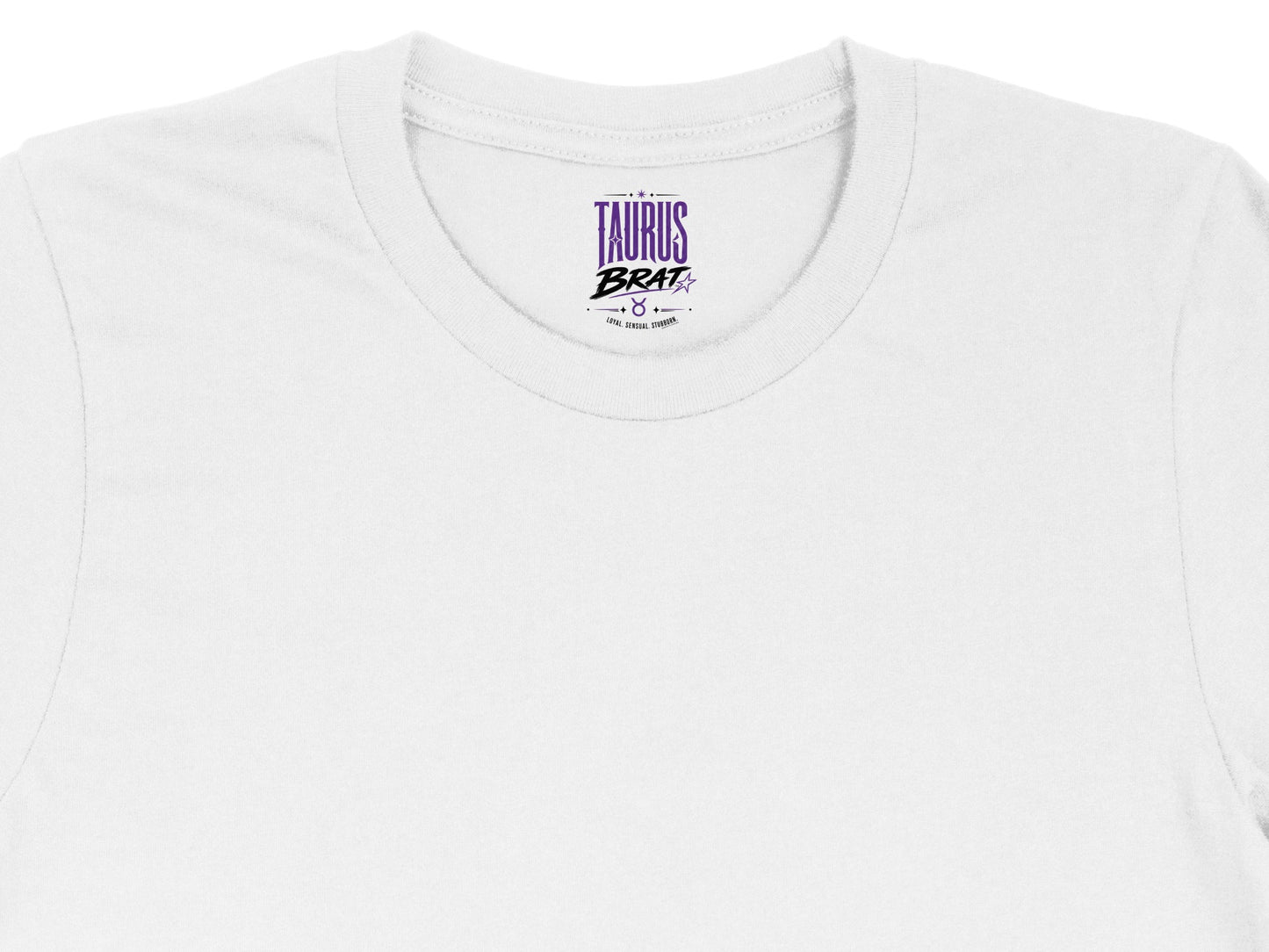 White t-shirt tag with Taurus Brat text and astrological symbol.