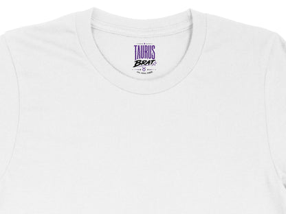 White t-shirt tag with Taurus Brat text and astrological symbol.