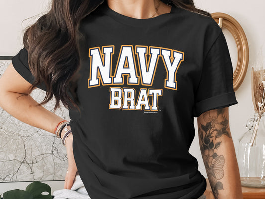 Black t-shirt with white "NAVY BRAT" text in collegiate font.