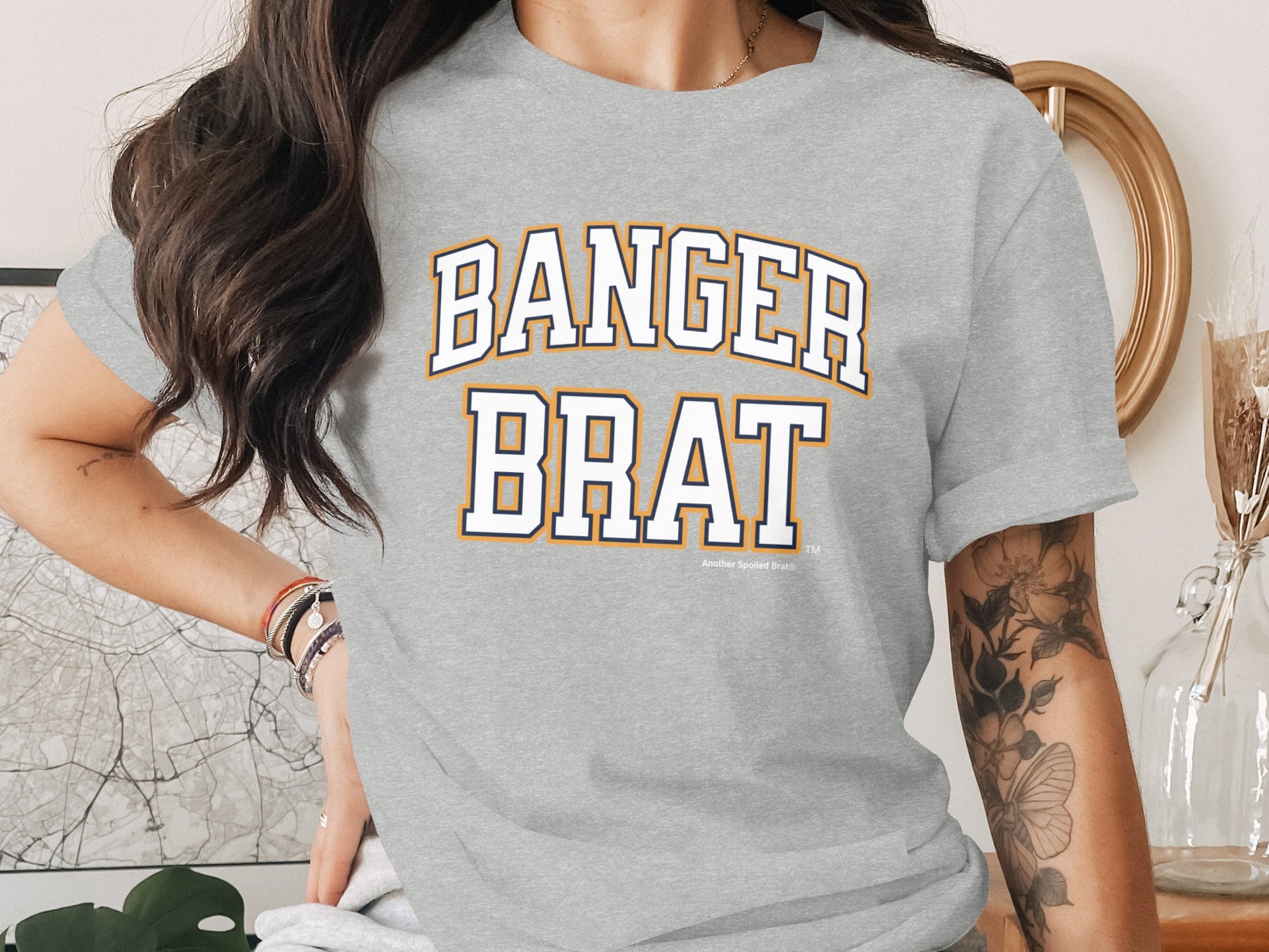 Grey t-shirt with "BANGER BRAT" in collegiate style lettering.