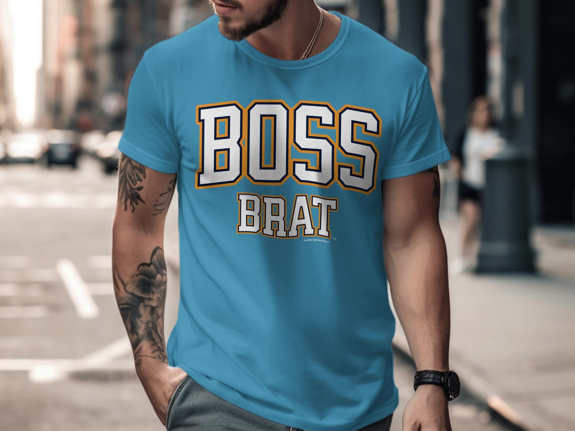 Blue t-shirt with "BOSS BRAT" text in white, black, and yellow.