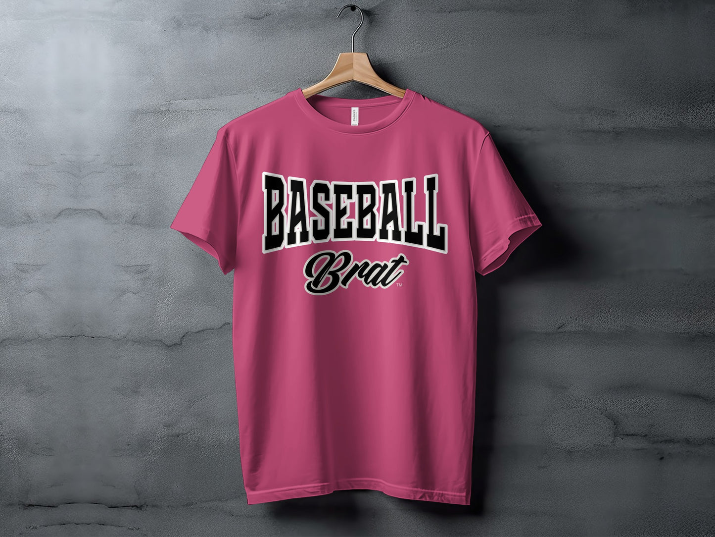 Pink t-shirt with "BASEBALL Brat" text in black and white lettering.