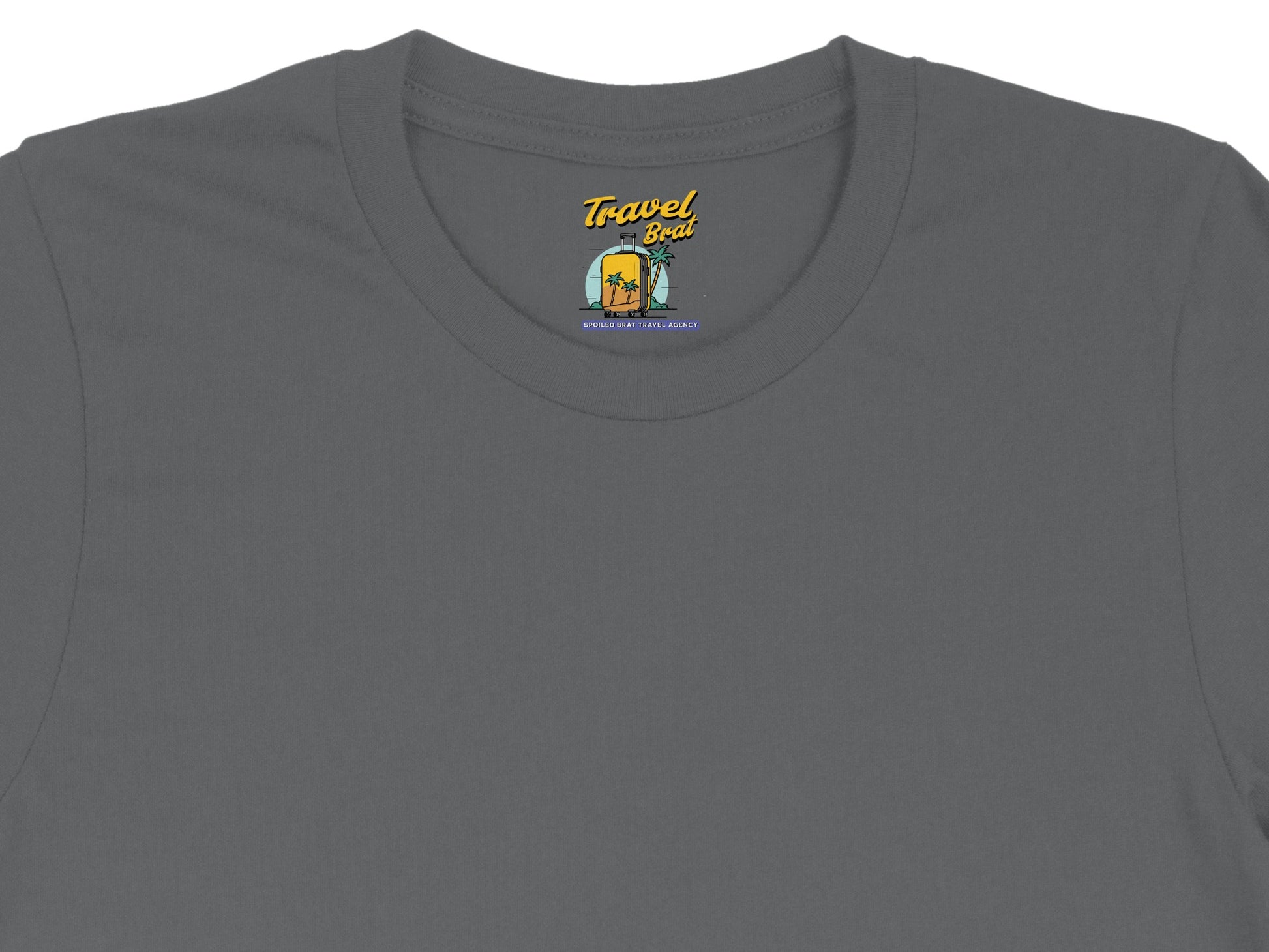 Grey t-shirt with "Travel Brat" logo featuring a suitcase and palm trees.