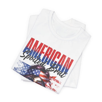White t-shirt with "AMERICAN SpoilED Brat" graphic featuring flag and woman.