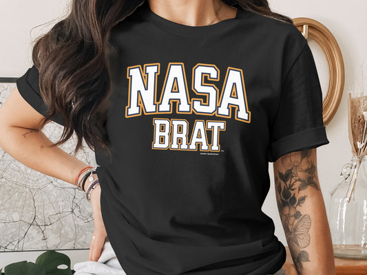 Black t-shirt with white and orange "NASA BRAT" text.