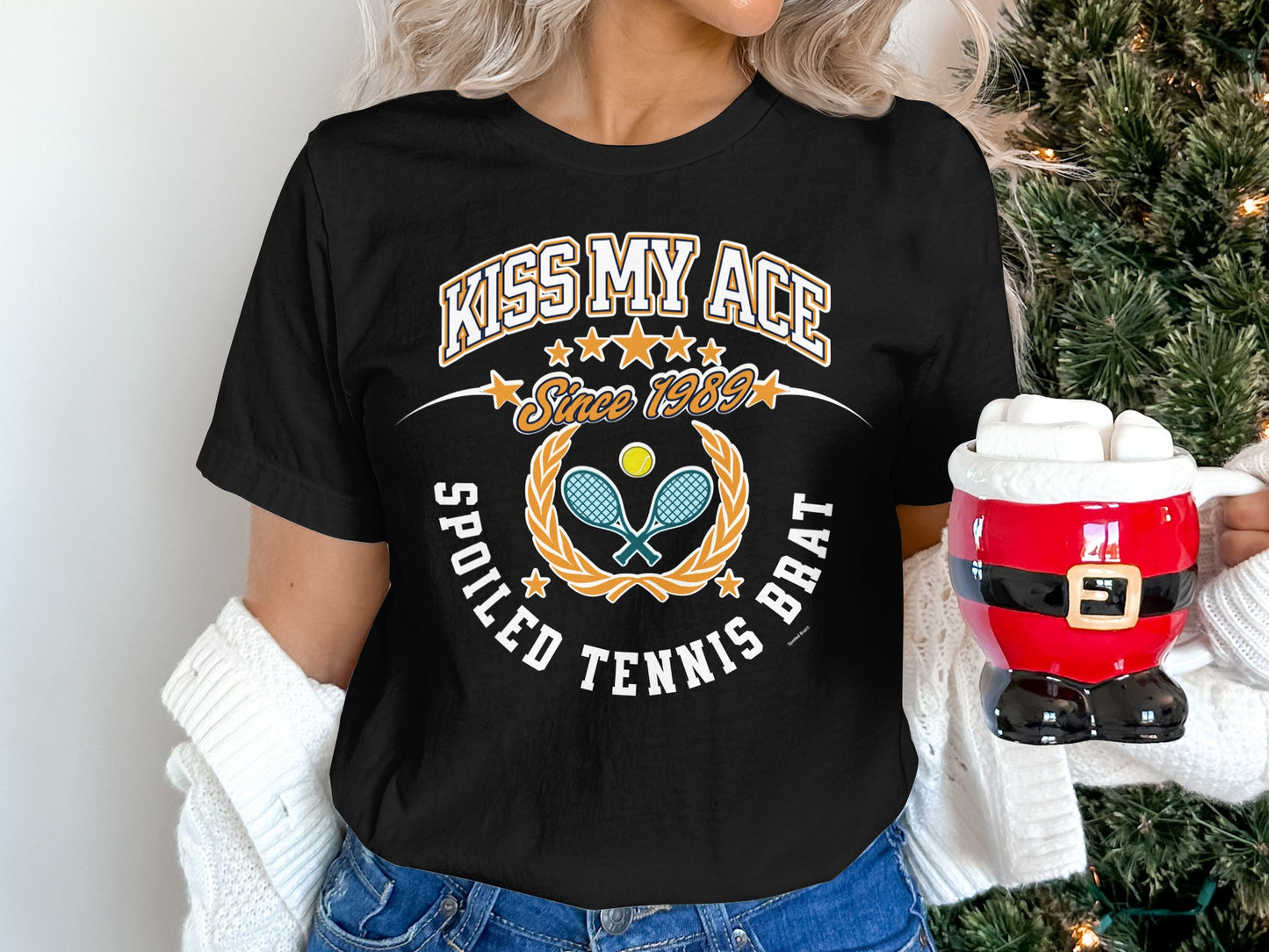 Black t-shirt with "Kiss My Ace Spoiled Tennis Brat" and crossed racquets.