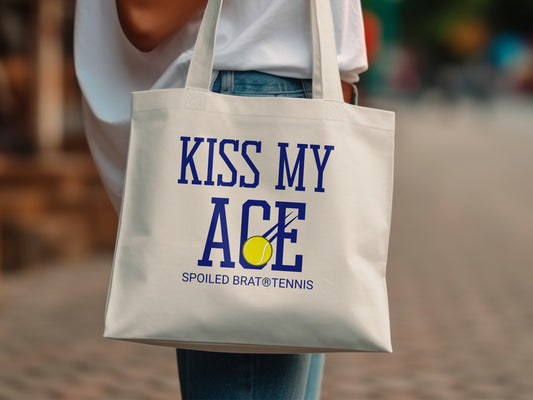 White tote bag with "KISS MY ACE" and a tennis ball graphic.