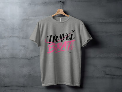 Grey t-shirt with "TRAVEL BRAT" text and airplane graphic.