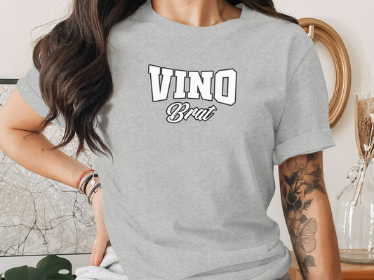Grey t-shirt with "VINO Brat" text in white and black outline.