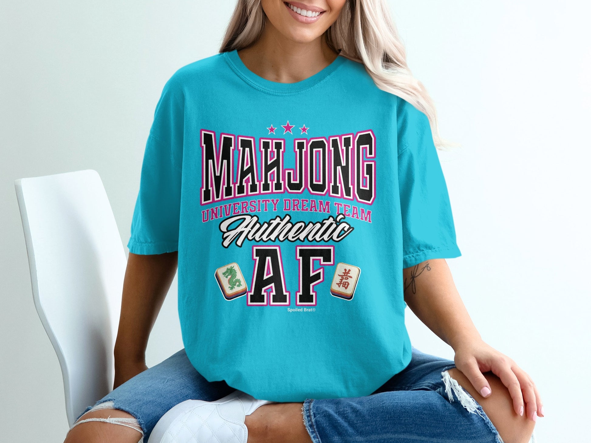 Teal t-shirt with "Mahjong University Dream Team Authentic AF" text and Mahjong tiles.