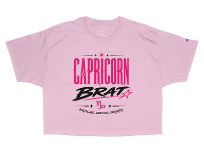 Pink cropped t-shirt with "CAPRICORN BRAT" text and zodiac symbol.