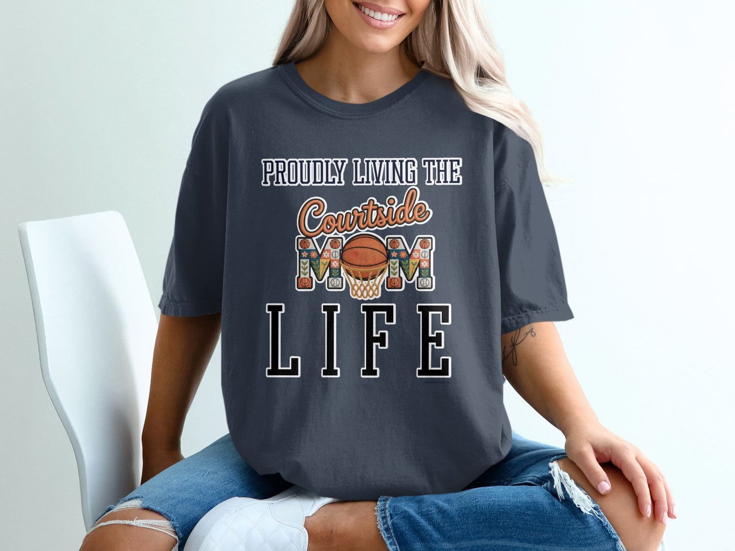 Graphic t-shirt with "Proudly Living The Courtside Mom Life" text and basketball graphic.