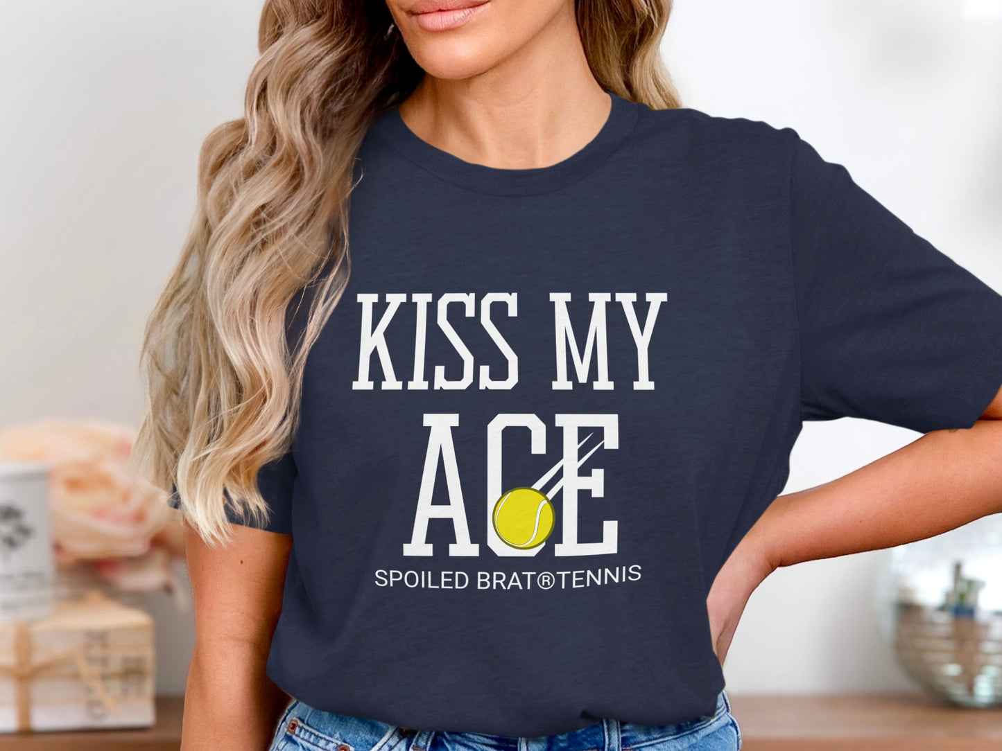 Navy t-shirt with "Kiss My Ace" and a tennis ball graphic.