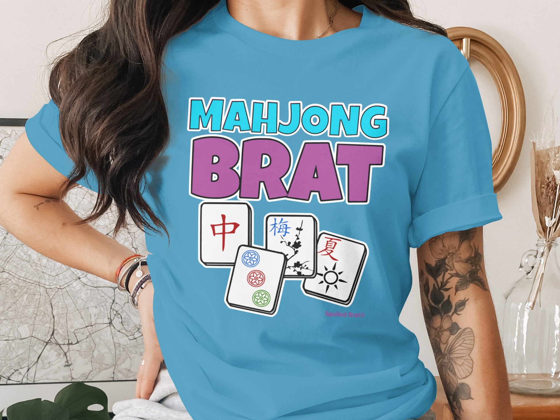 Blue t-shirt with "MAHJONG BRAT" text and Mahjong tiles.