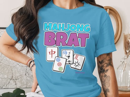 Blue t-shirt with "MAHJONG BRAT" text and Mahjong tiles.