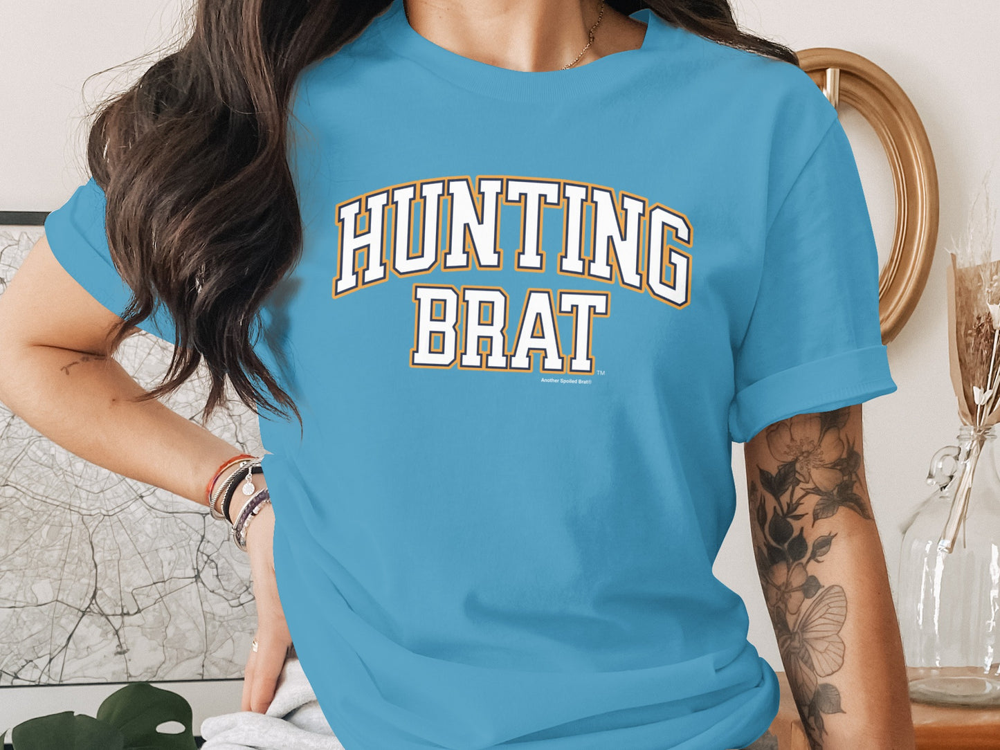 Blue t-shirt with "HUNTING BRAT" text design, Another Spoiled Brat logo.