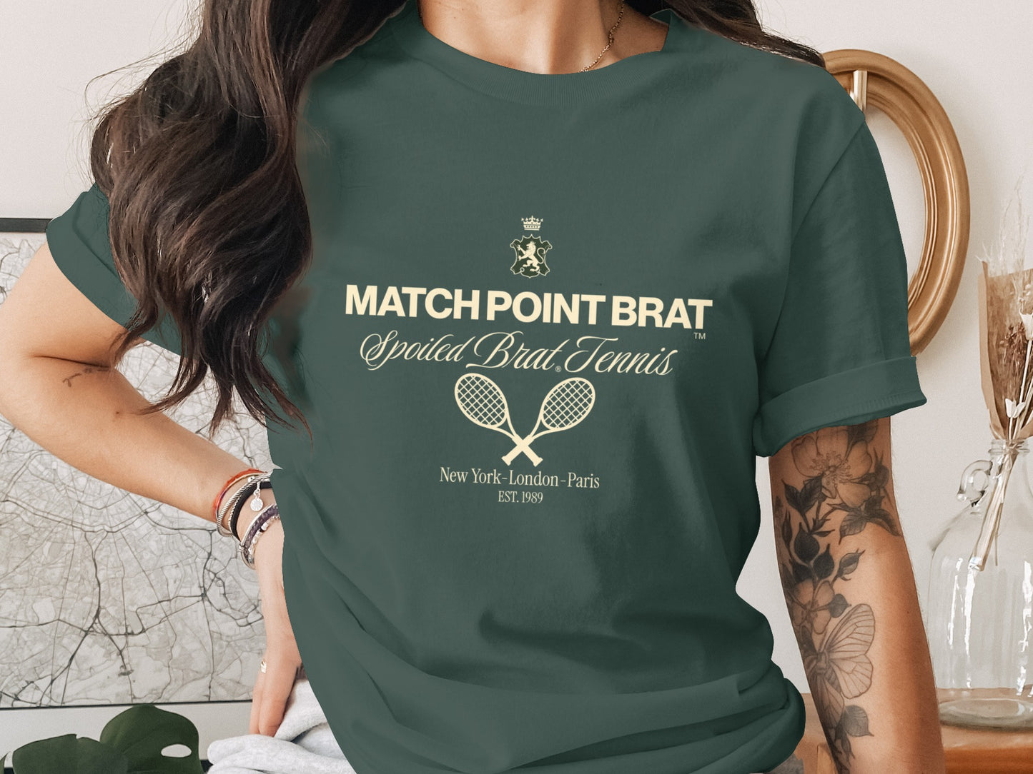 Green t-shirt with "MATCH POINT BRAT Spoiled Brat Tennis" text and tennis rackets.