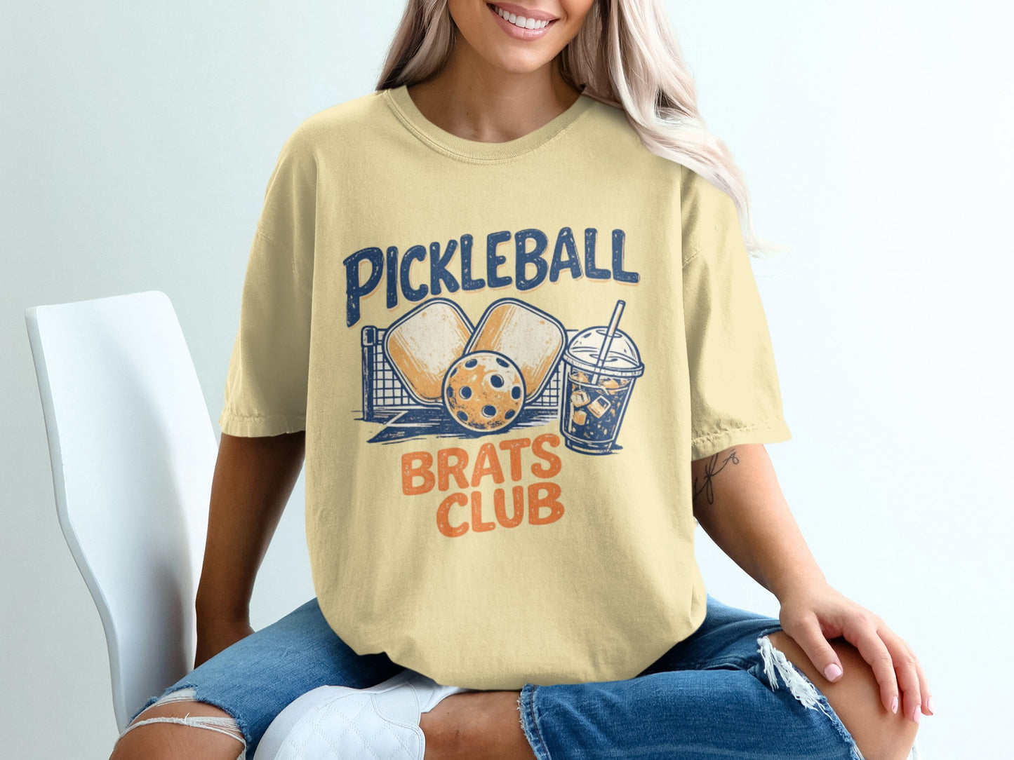 Yellow t-shirt with "Pickleball Brats Club" and pickleball graphics.