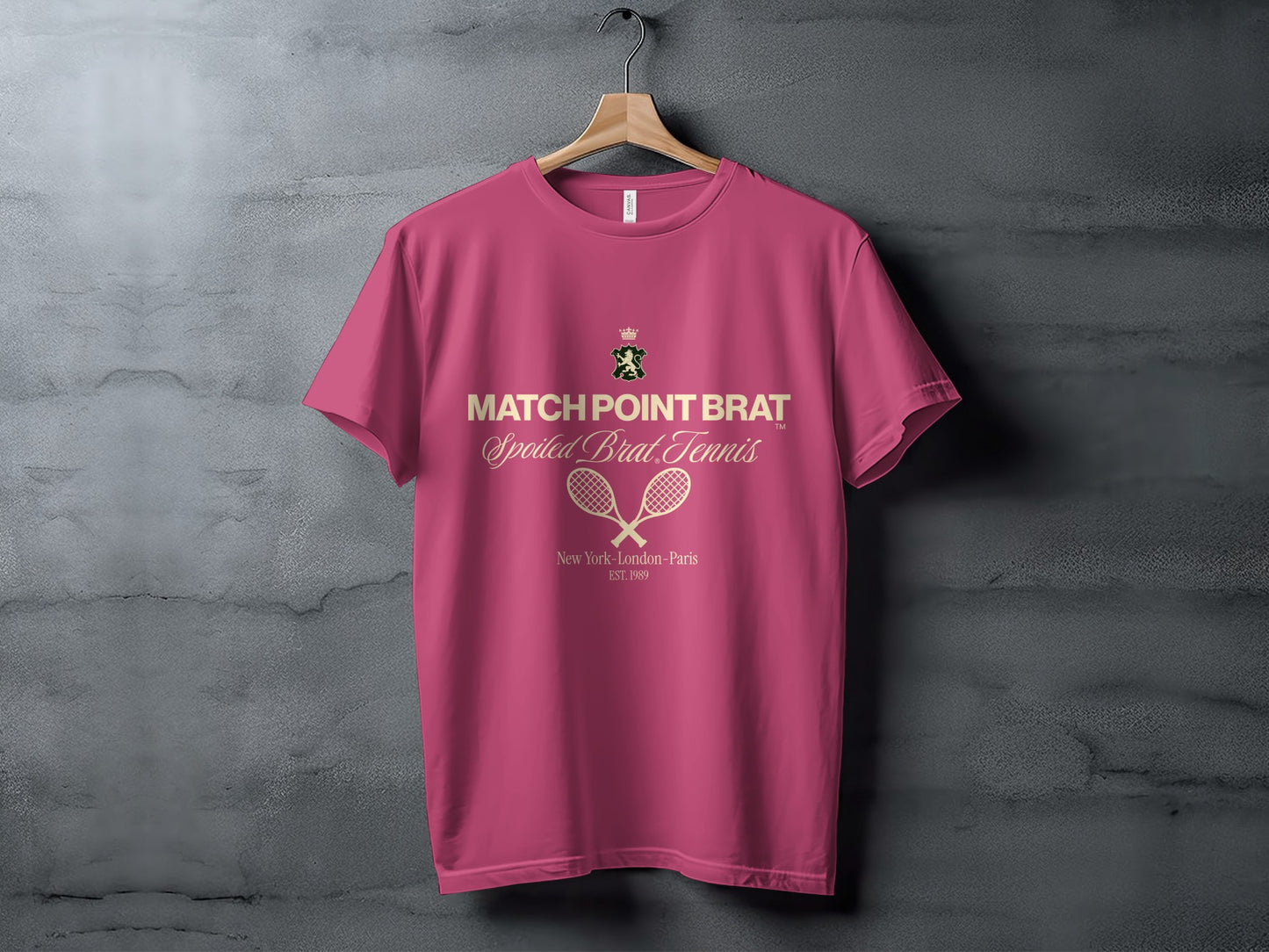 Pink t-shirt with "MATCH POINT BRAT" and tennis rackets graphic.