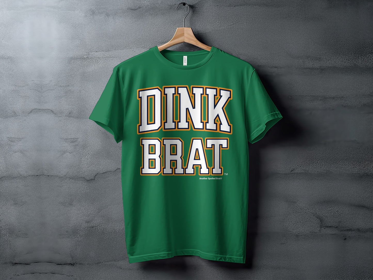 Green t-shirt with white and orange "DINK BRAT" text.
