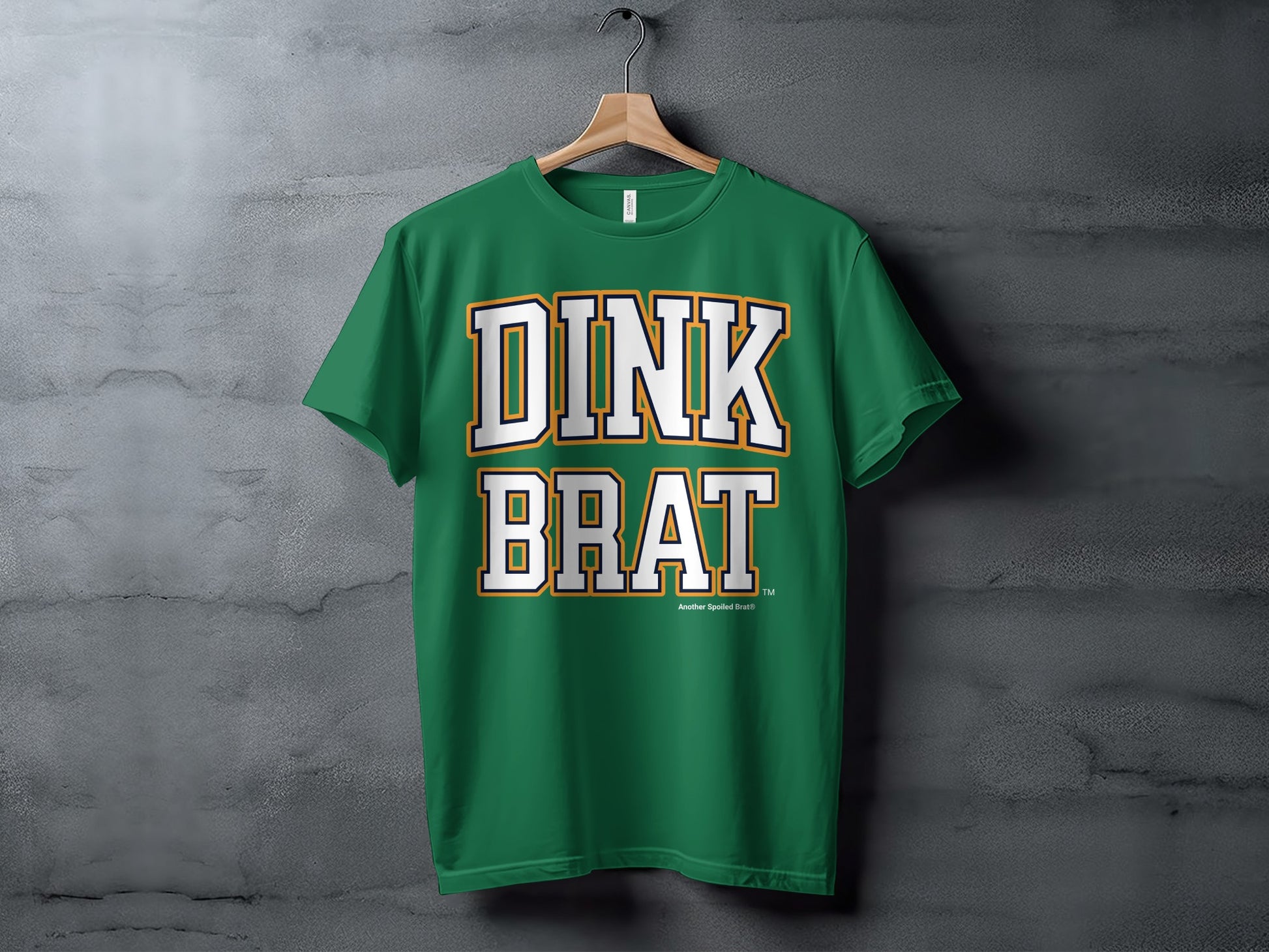 Green t-shirt with white and orange "DINK BRAT" text.